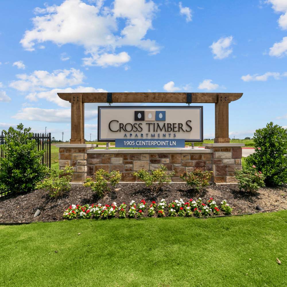 Sign board of apartments at Cross Timbers Apartments in Greenville, Texas