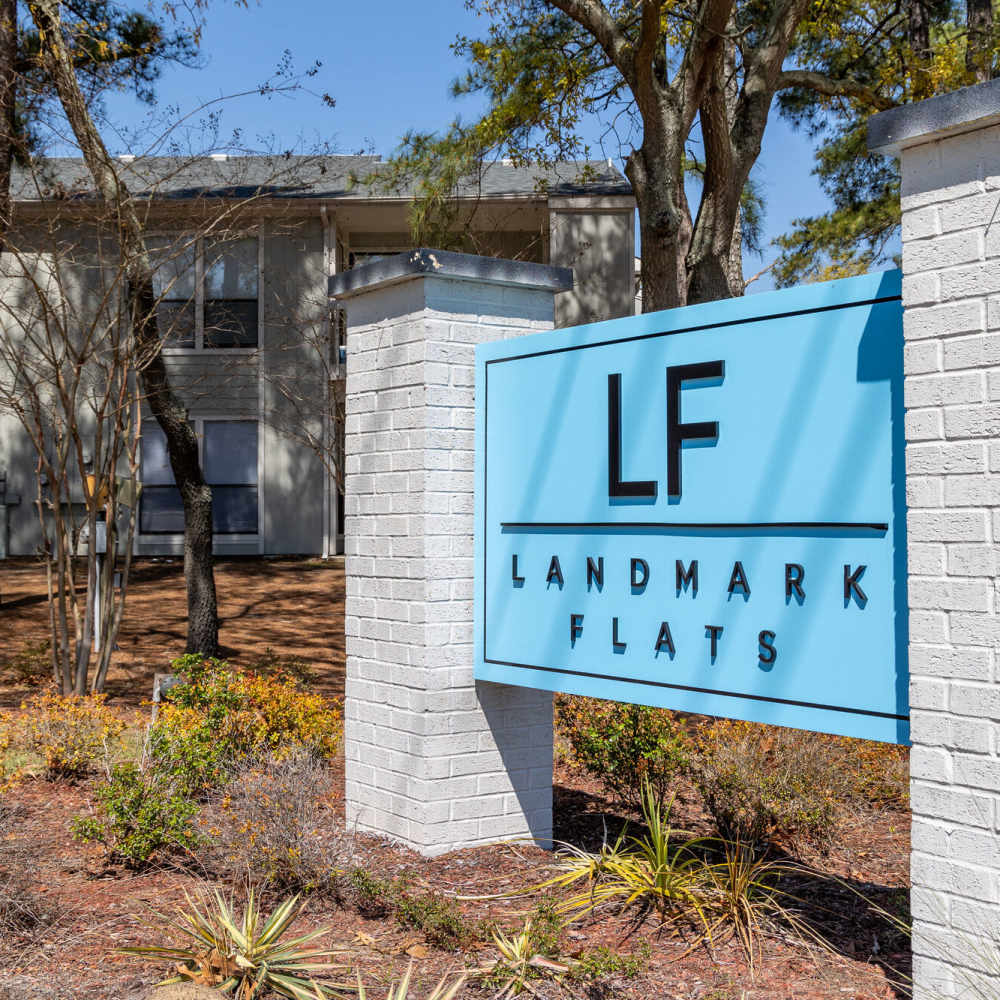 Property signage board at Landmark Flats in Fayetteville, North Carolina