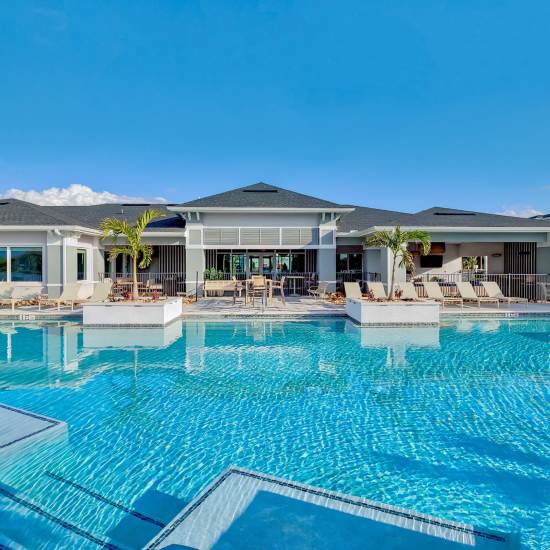 A resort style swimming pool with sparkling clean water at Charlotte Commons in Port Charlotte, Florida