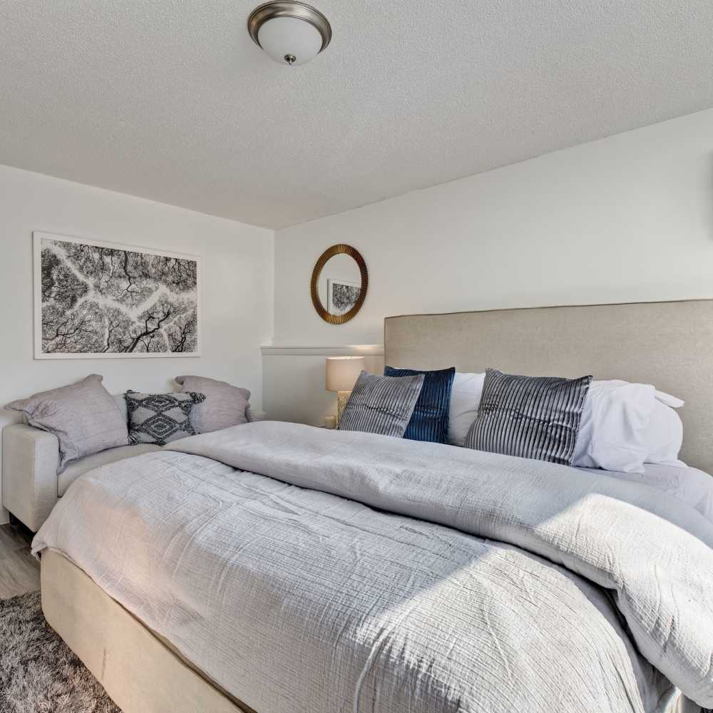 Bedroom with comfortable bed at The Otis in Dallas, Texas