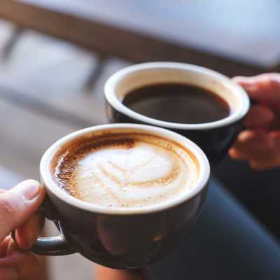 Hands with a coffee cups at Lemon Bay Apartments in Englewood, Florida