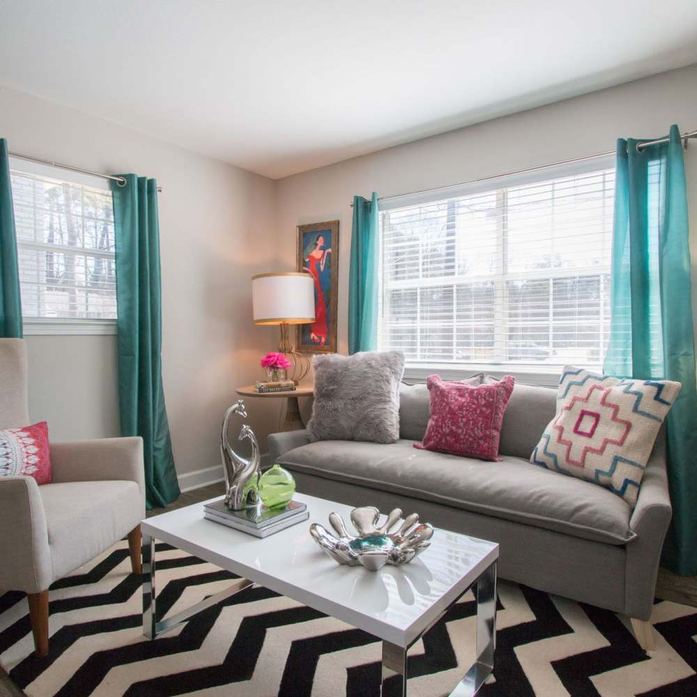 Living room with large sofa and center table at Avonlea Westside in Atlanta, Georgia