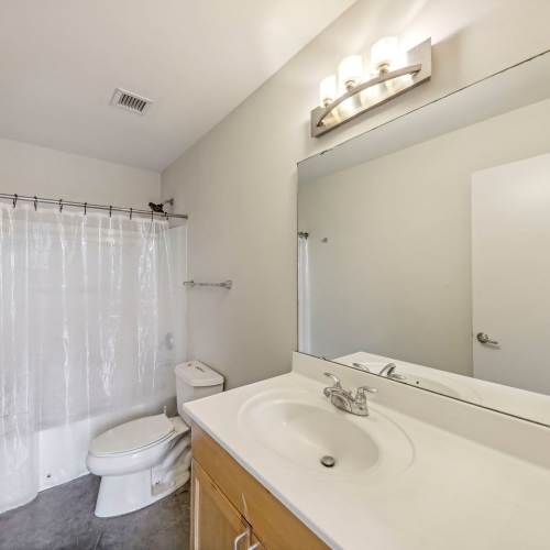 Unfurnished bathroom with vanity at Stadium Loft Apartments in Saint Louis, Missouri