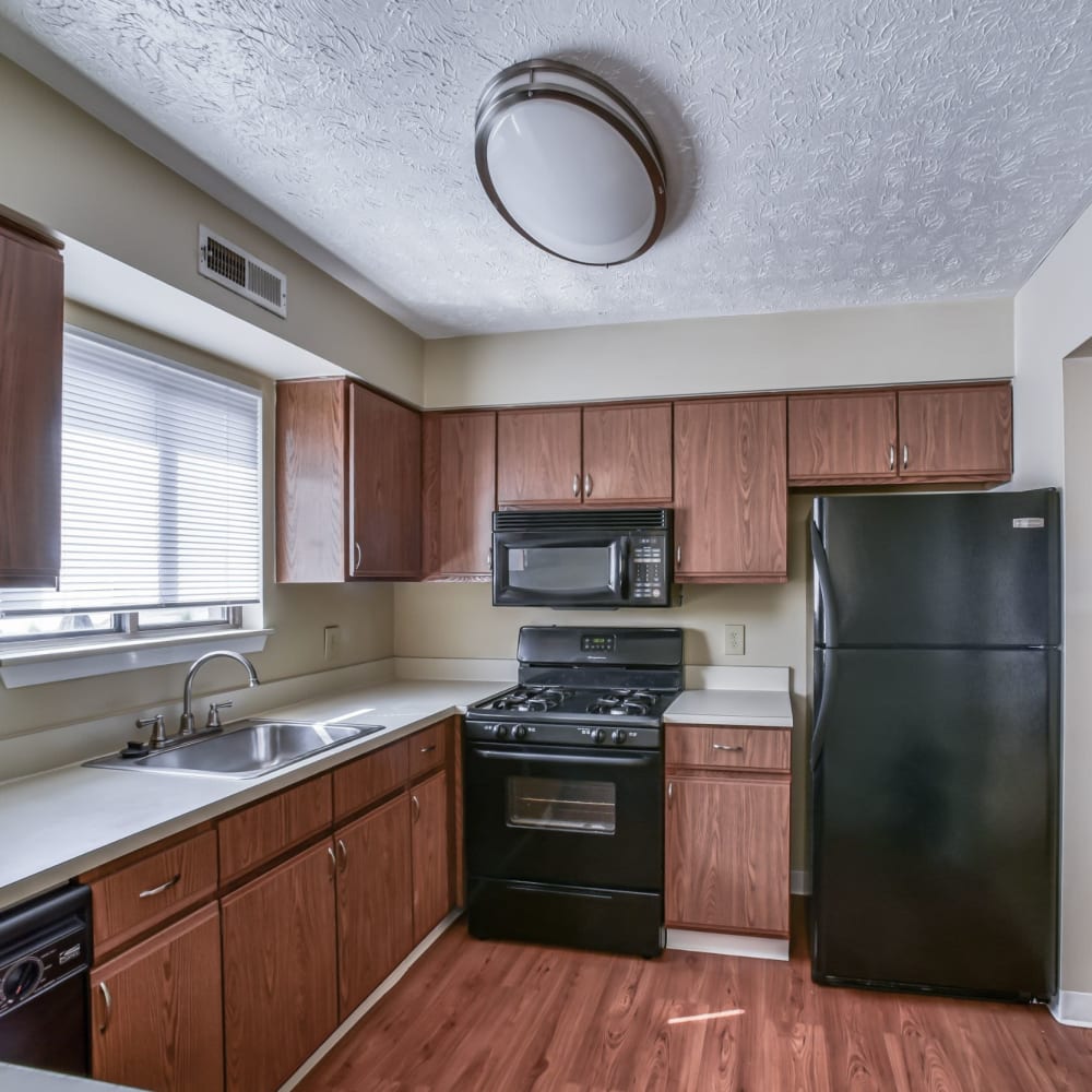 Kitchen with wood-style flooring at Ravenna Woods, Twinsburg, Ohio