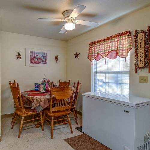 Dining area and refrigerator at Yellowbud Place in Moorefield, West Virginia