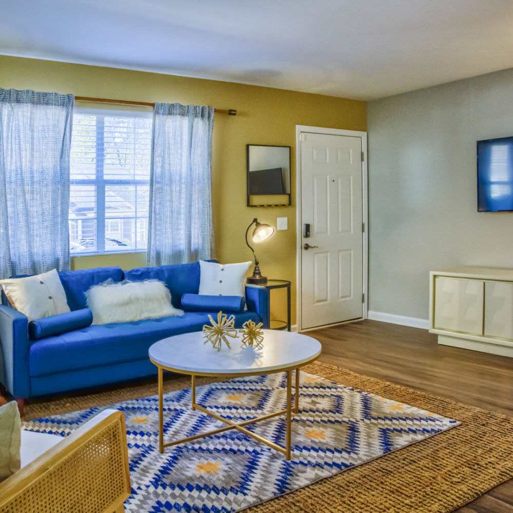 Living room withh large window and television at Avonlea Westside in Atlanta, Georgia