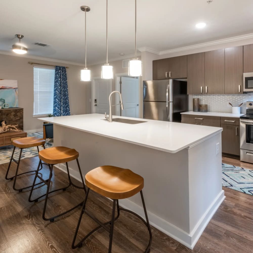 Large kitchen island with stools at Verso Luxury Apartments in Davenport, Florida