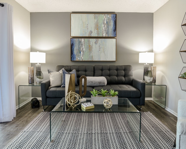 Living room with modern decor at The Regent in Dallas, Texas