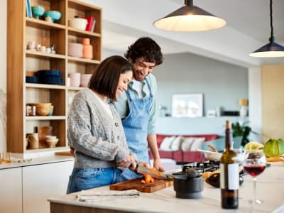 Couple cooking together at Sequoyah Apartments in Concord, California