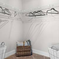 Two laundry baskets and hangers on a rack at Chamberlain Pines in Summerville, South Carolina