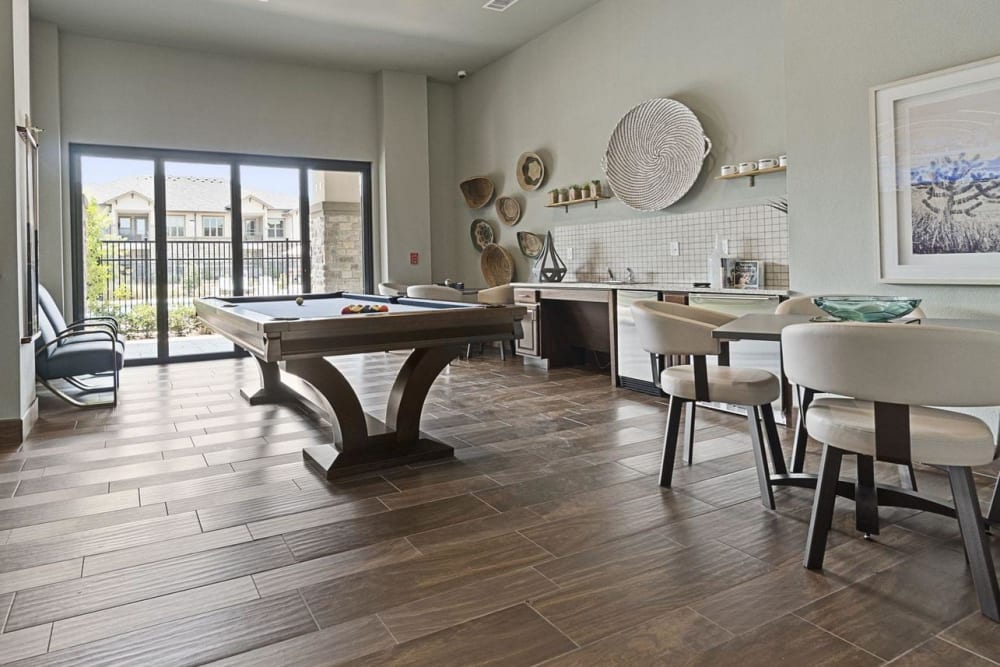 Resident lounge and game room with a pool table and coffee bar at Auberge of Tyler in Tyler, Texas