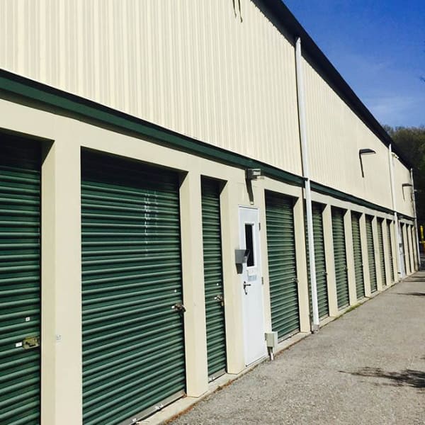 Outdoor storage units with green doors at StorQuest Express Self Service Storage in Briarcliff Manor, New York