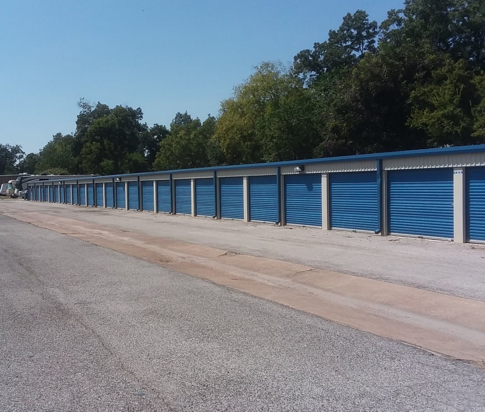 Row of outdoor storage units at AAA Alliance Self Storage in Humble, Texas