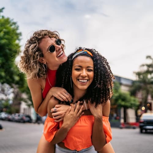 Residents having fun outside of The Marquis of State Thomas in Dallas, Texas