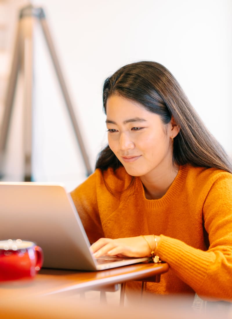Resident working from a café near Marquis at Crown Ridge in San Antonio, Texas