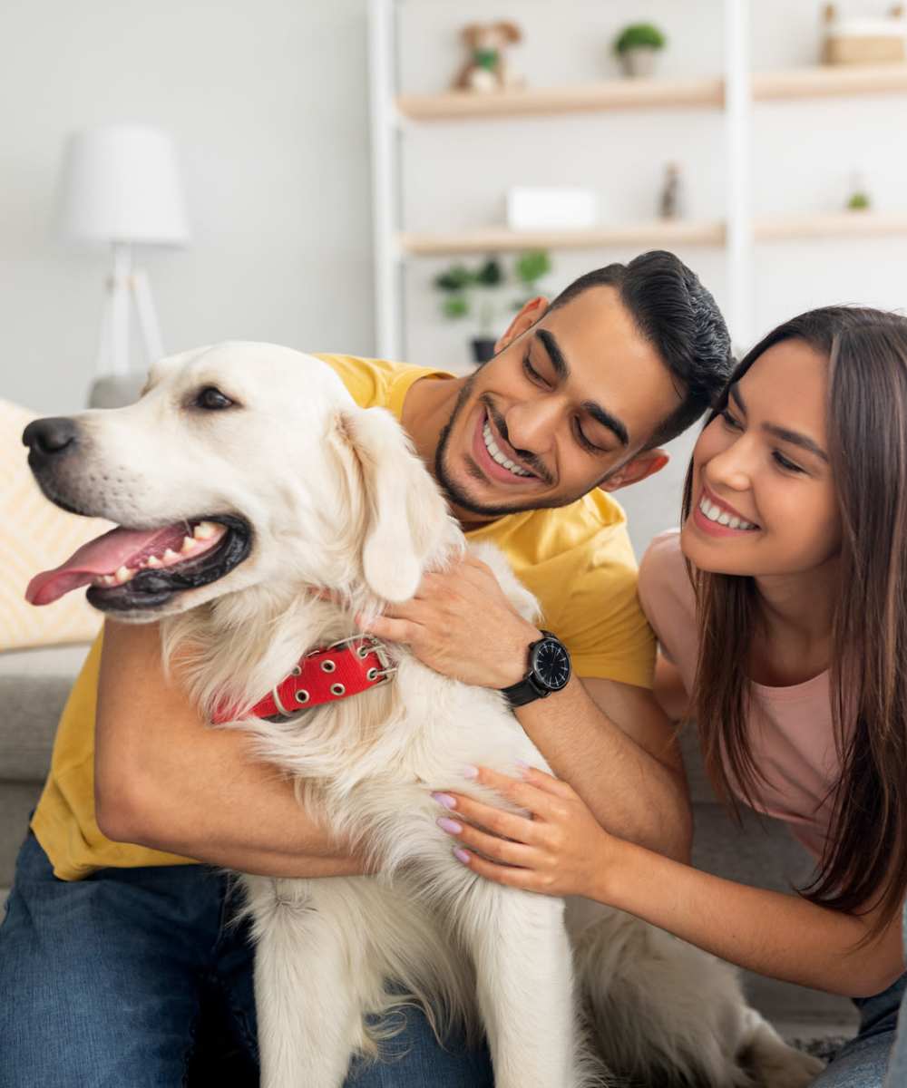 Resident couple with their pet dog at 440 on Third Apartments in Baton Rouge, Louisiana