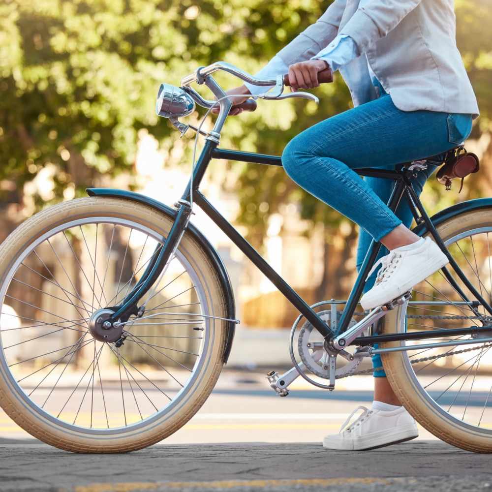 Resident riding bicycle in street near at Rosewood at Clemson in Central, South Carolina 