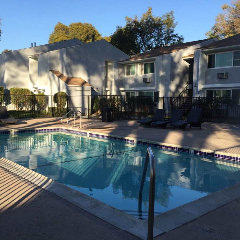 Swimming pool with view to apartment community at Fairview Green in Santa Ana, California