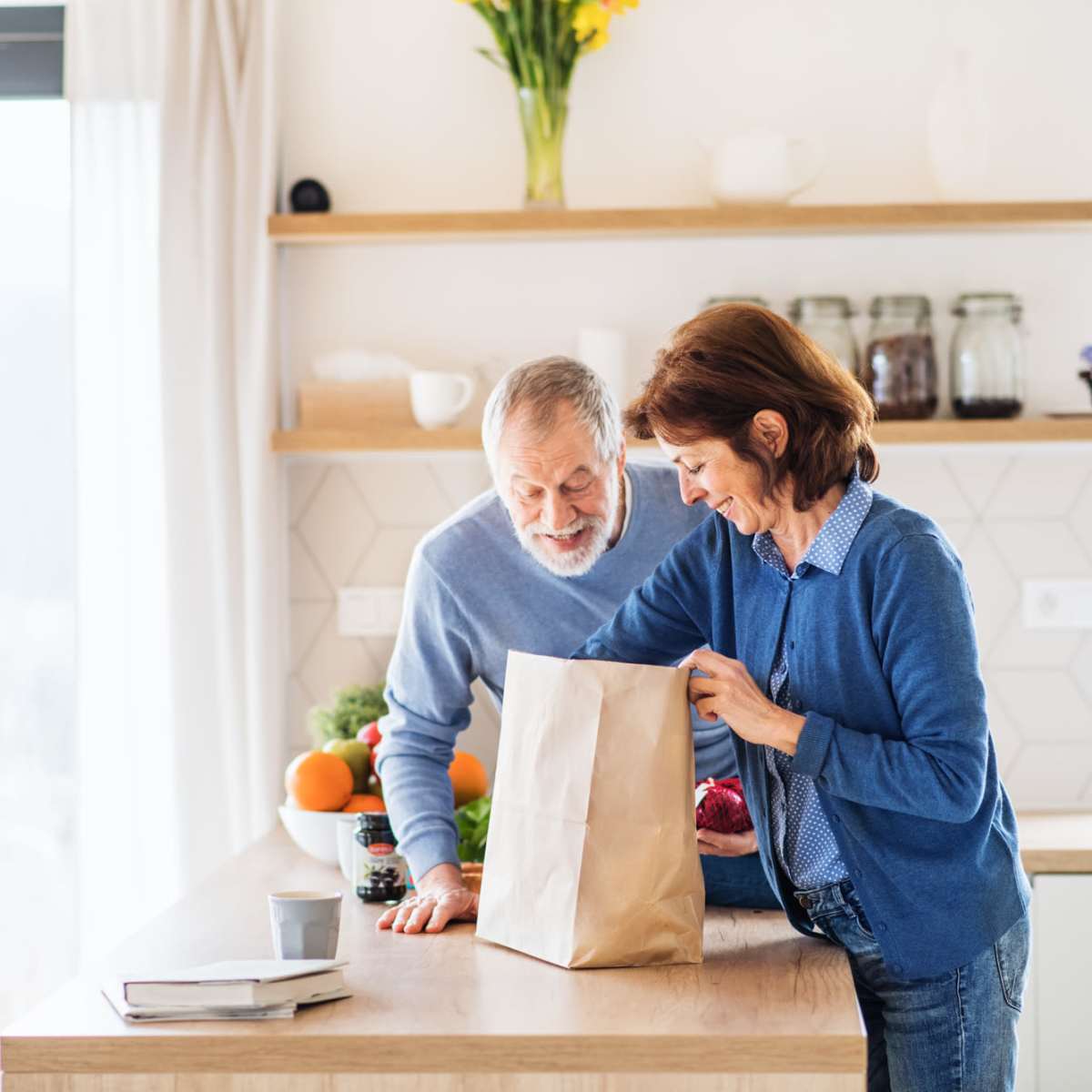 Couple unpacking groceries in their Harmony Senior Services senior living community