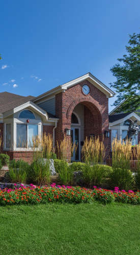 Property exterior with a lawn in the front at The Dakota at Governors Ranch in Littleton,Colorado