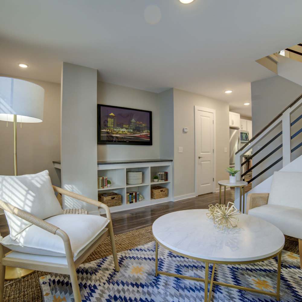 Living room with staircase at Avonlea Westside in Atlanta, Georgia