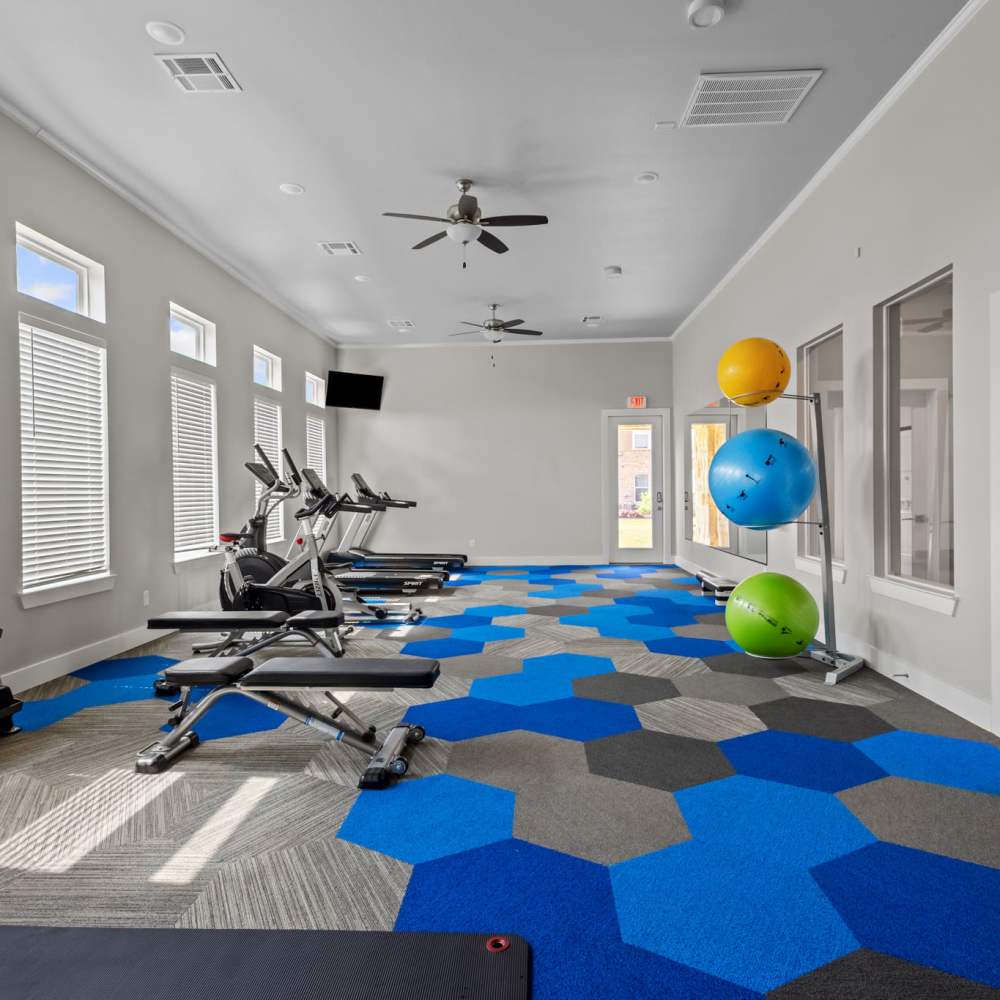 Fitness center with treadmills, exercise ball and ceiling fan at Deer Park in Athens, Texas