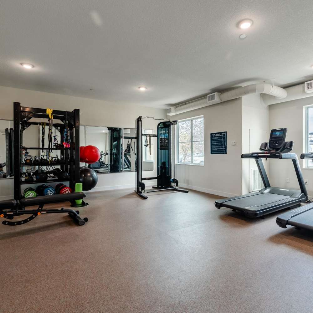 Apartment community fitness center with gym equipment's at WaterWalk Wichita - Downtown in Wichita, Kansas