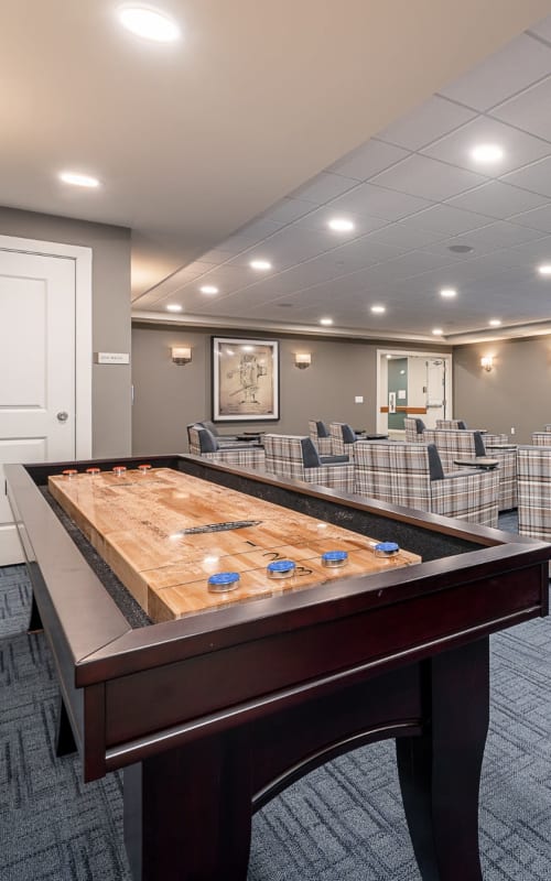 Shuffleboard and game room at The Pillars of Hermantown in Hermantown, Minnesota