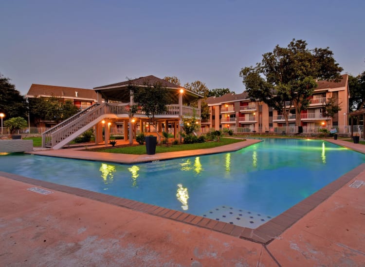 Beautiful pool with gazebo at dusk at Oasis at Oakwell in San Antonio, Texas