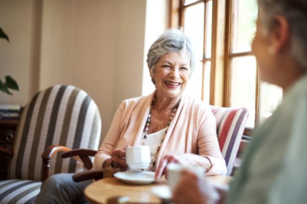 Residents having coffee at The Springs at Lancaster Village in , Oregon