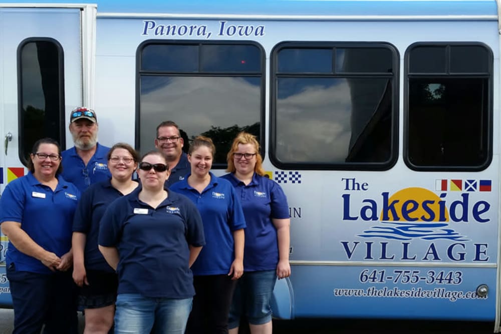 Staff members and the activity bus at The Lakeside Village in Panora, Iowa.