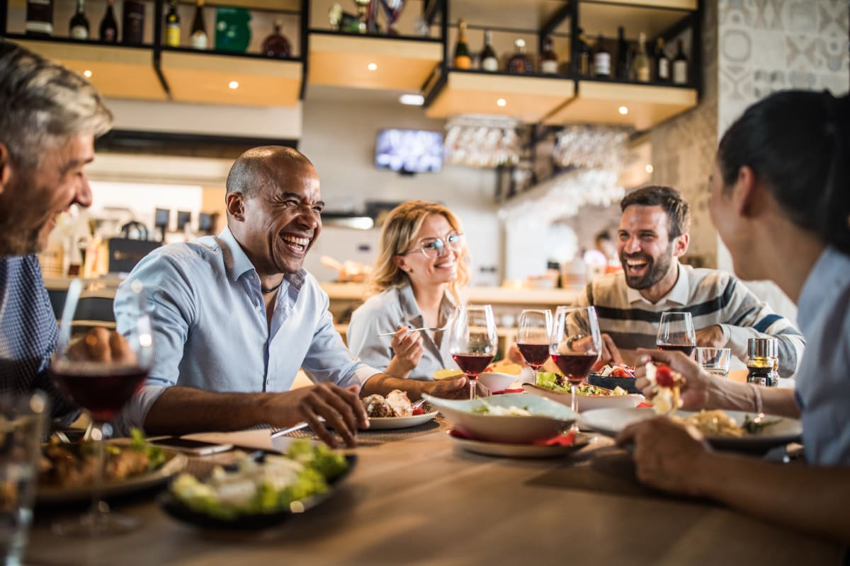 Friends having fun dining near Ruxton Tower in Towson, Maryland