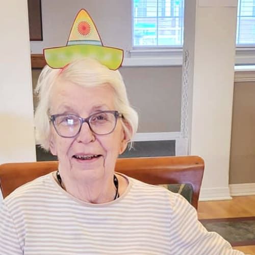 Resident with a fun hat at Homestead House in Beatrice, Nebraska