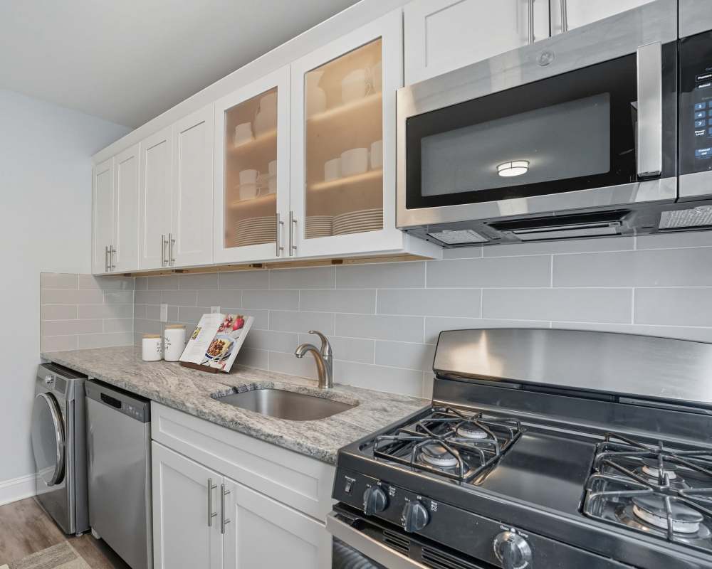 Renovated kitchen with stainless steel appliances at Eagle Rock Apartments at Huntington Station in Huntington Station, New York