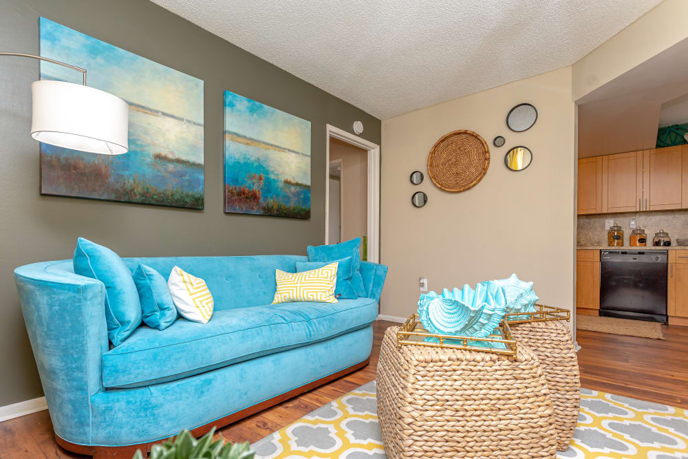 Spacious and well-furnished open-concept living area in a model home at Fairway View Apartments in Hialeah, Florida