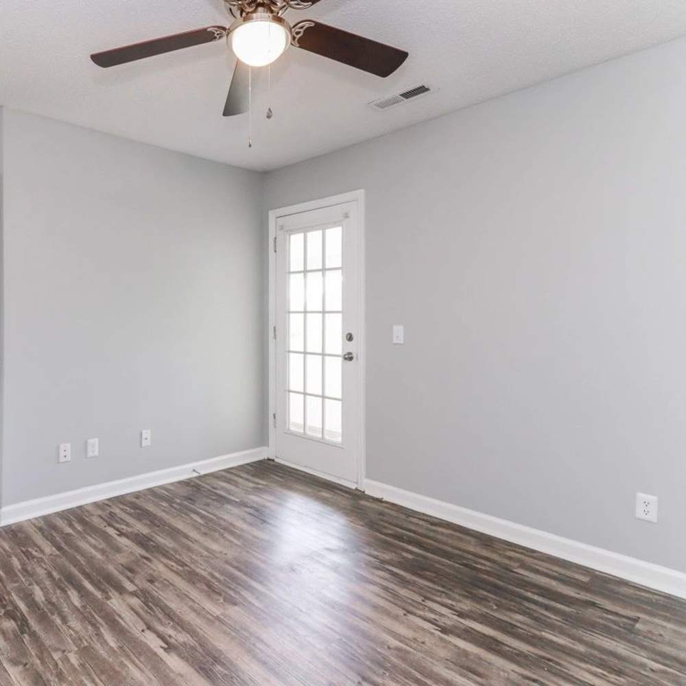 Hardwood-floored room with a door at The Oaks At Northshore in Chattanooga, Tennessee