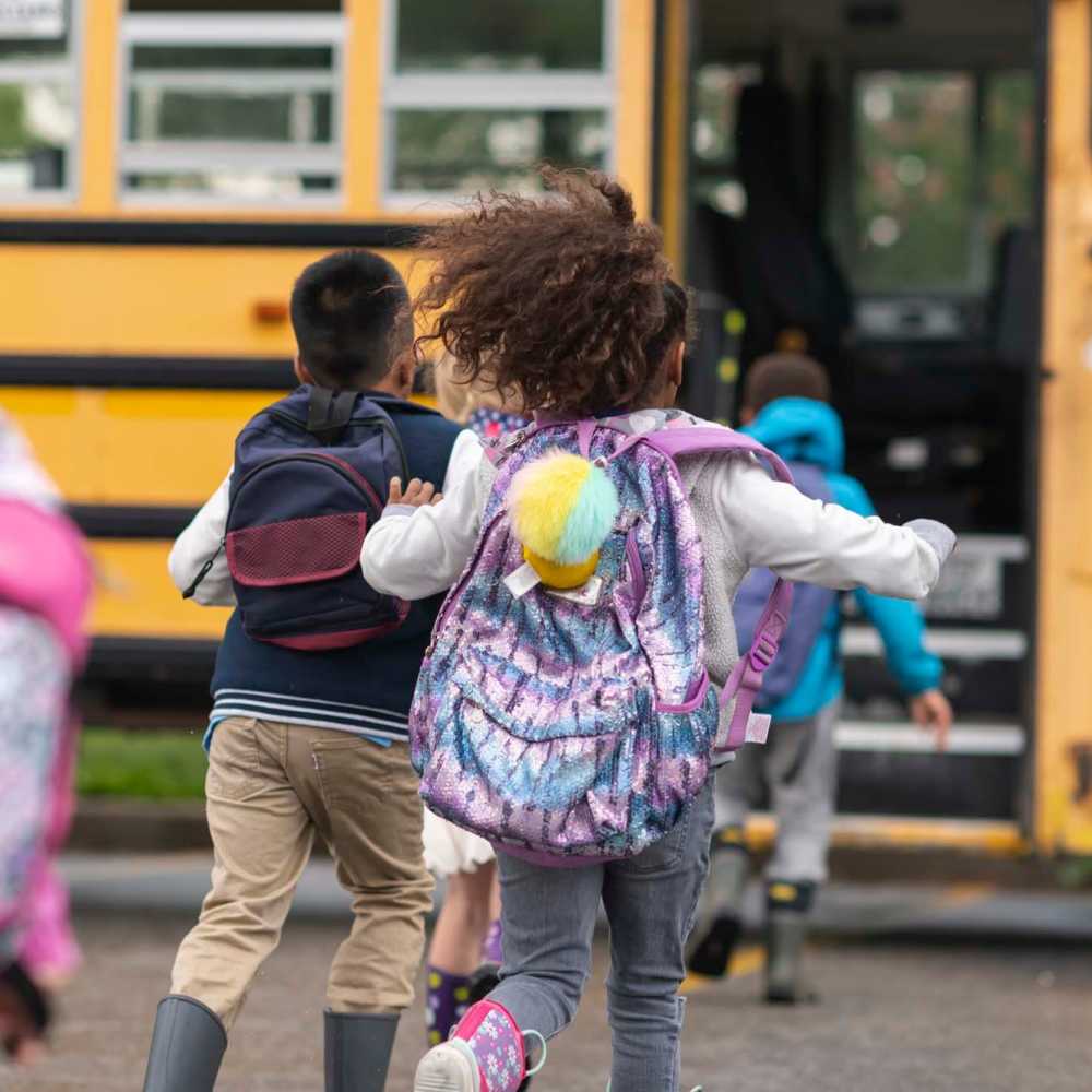 Resident kid going to school bus near Spartan Ridge in Eightmile, Alabama