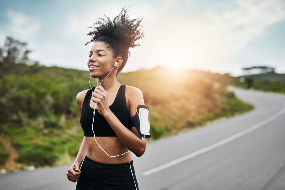 A woman on a jog near Wildreed Apartments in Everett, Washington