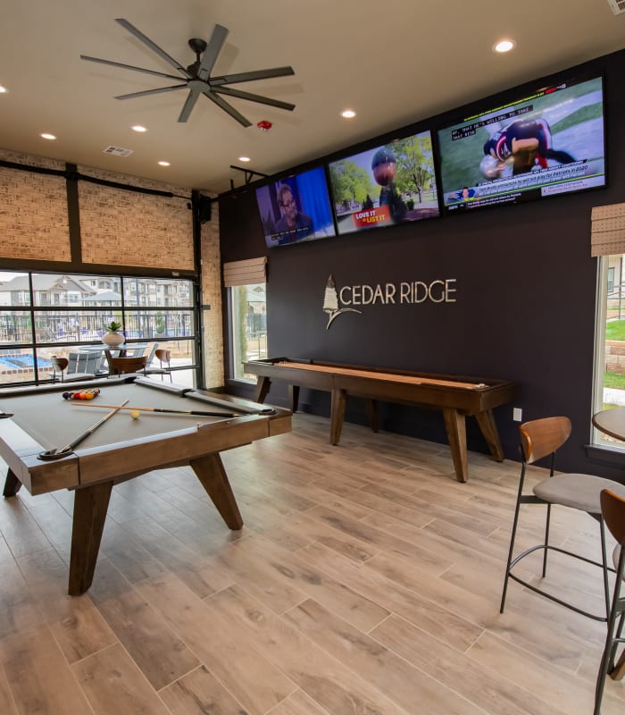 Resident clubhouse with pool table at Cedar Ridge in Tulsa, Oklahoma