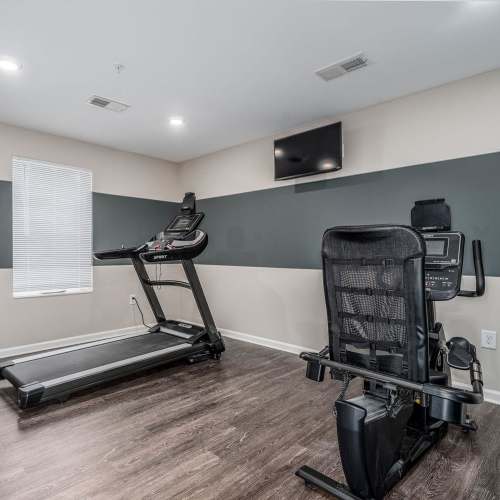 Fitness center with exercise bike at Northlake Center Apartments in Charlotte, North Carolina