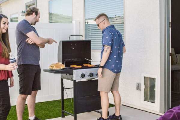 Residents grilling at Christopher Todd Communities At Stadium in Glendale, Arizona