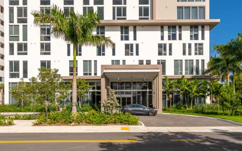 Entrance of senior living apartments at The Barclay at ParkSquare in Aventura, Florida
