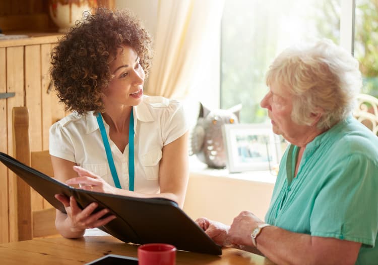 Nursing and resident having a conversation at The Reserve at Thousand Oaks in Thousand Oaks, California