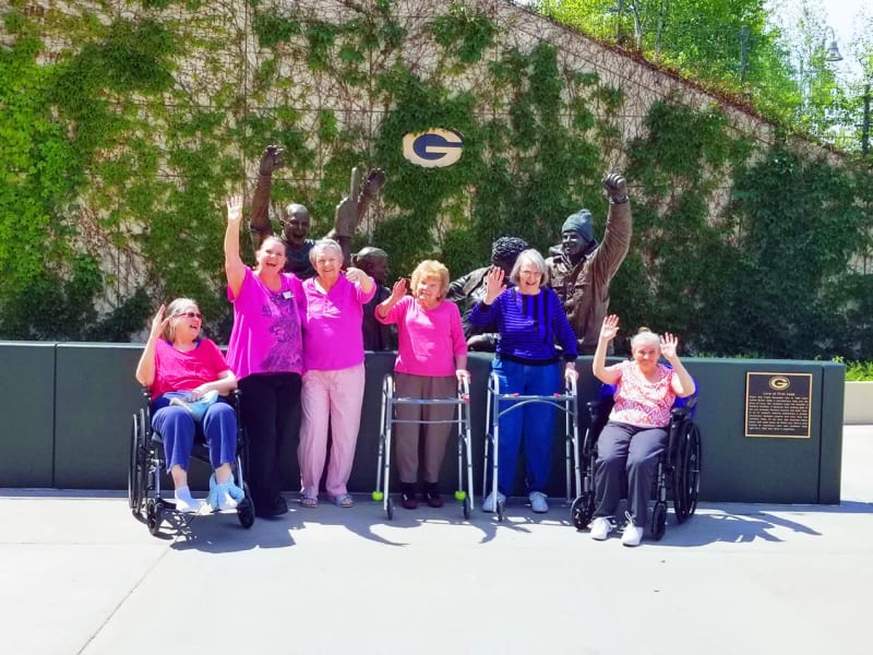 A cheerful group of residents at Wyndemere Memory Care in Green Bay, Wisconsin. 