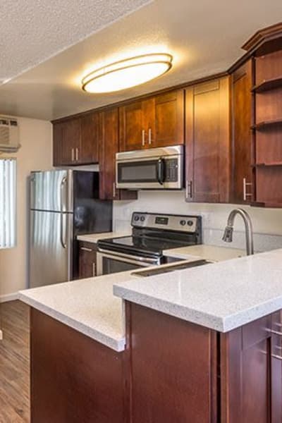 Kitchen with modern appliances at Villa Esther, West Hollywood, California