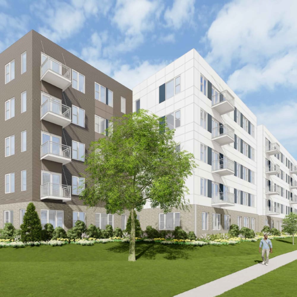 Exterior view with balconies and green lawn at The Intersect in Madison, Wisconsin 
