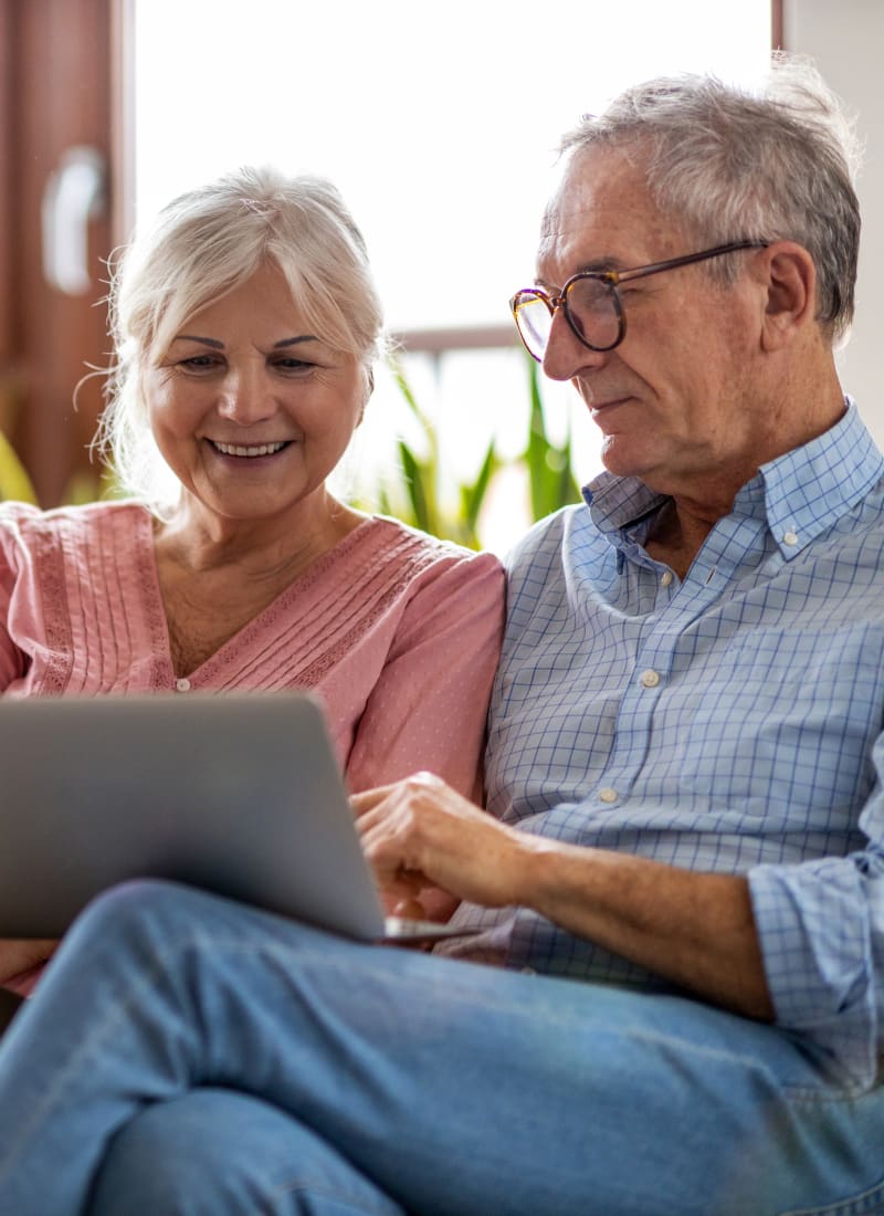 Residents relaxing on their couch at Plano, Texas from Brooks on Preston