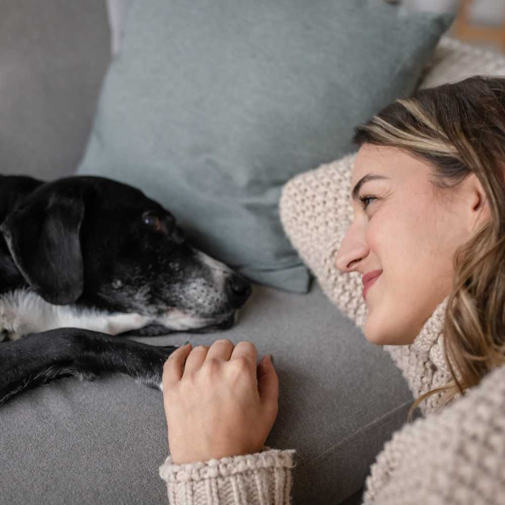Resident with her pet dog at Tucasa Townhomes in Irving, Texas