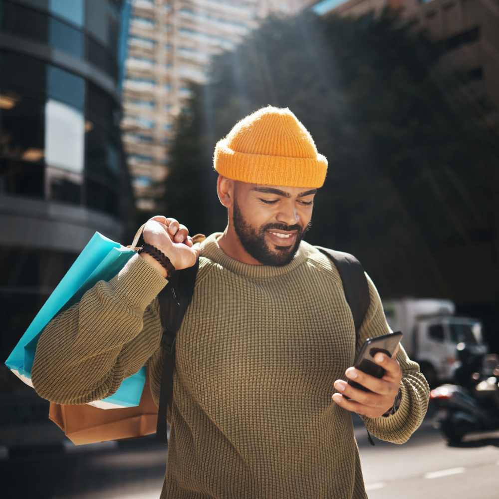 Resident with shopping bags in the neighborhood near Ridge Commons in Lafayette, Louisiana