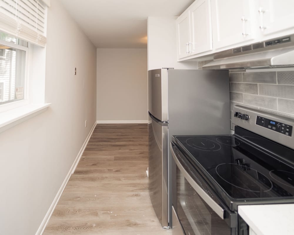 Modern kitchen with stainless-steel appliances at Enclave & Parc West in West Hartford, Connecticut